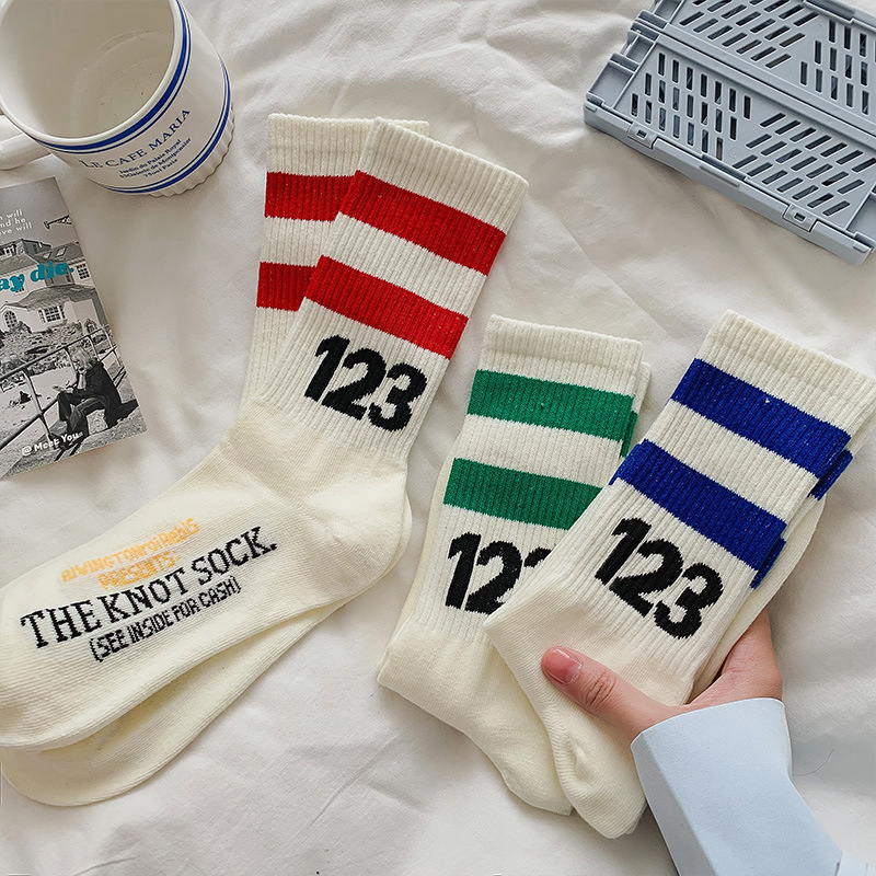 fashion design logo jacquard knitted custom athletic striped cotton sport socks